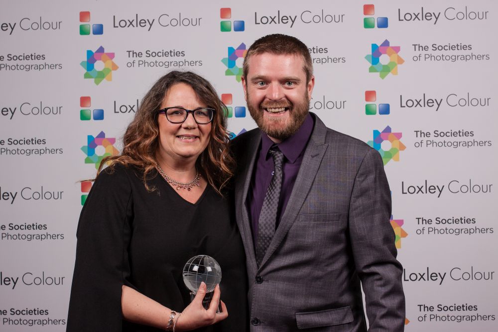 Ben Jones presenting Christina Lauder with the award.