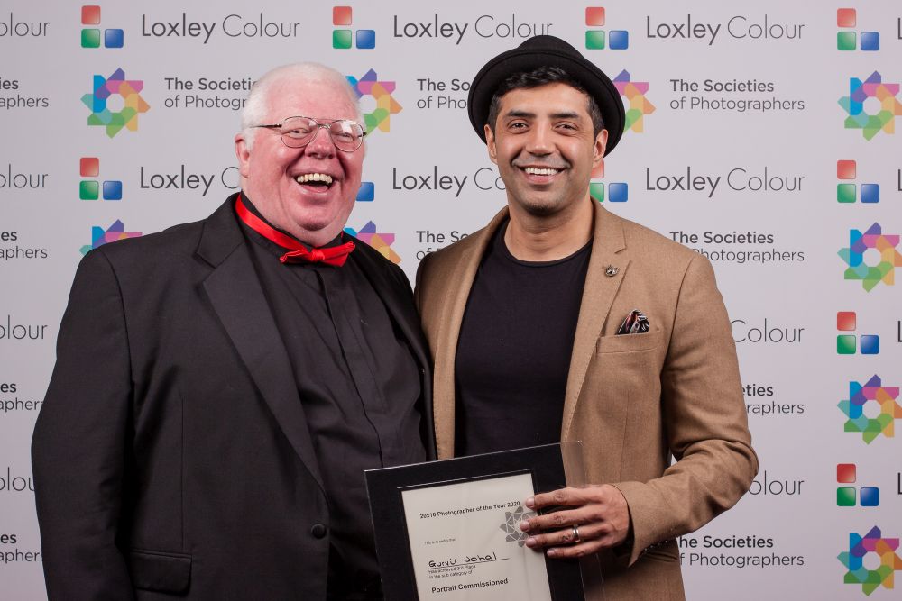 Phil Jones presents  Gurvir Johal with the award.