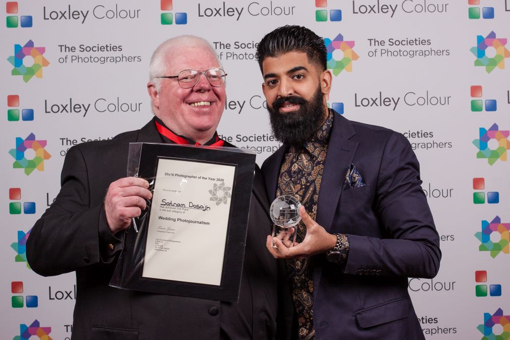 Phil Jones presents Satnam Dosajh with the award.