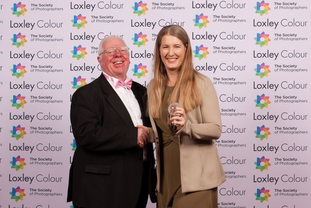 Phil Jones, The Society of Photographers' Director presenting the trophy to Stefanie.