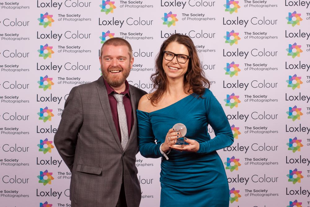 Ben Jones The Society of Photographers Member Value & Experience Manager presenting Martina with the trophy.