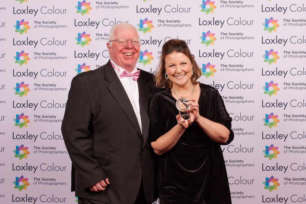 Phil Jones, The Society of Photographers Director presenting the trophy to Hanna.