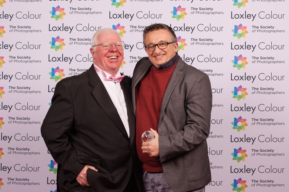 Phil Jones, The Society of Photographers Director presenting the trophy to Duncan.