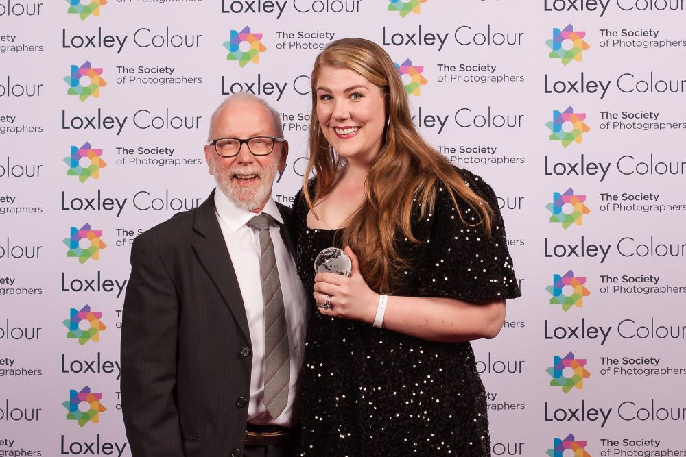 Mike McNamee, Editor of Professional Imagemaker magazine presenting Clare with the Trophy.