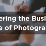 A photographer sitting across the table from clients, discussing options or going over a contract