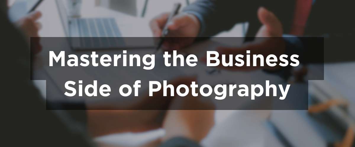 A photographer sitting across the table from clients, discussing options or going over a contract