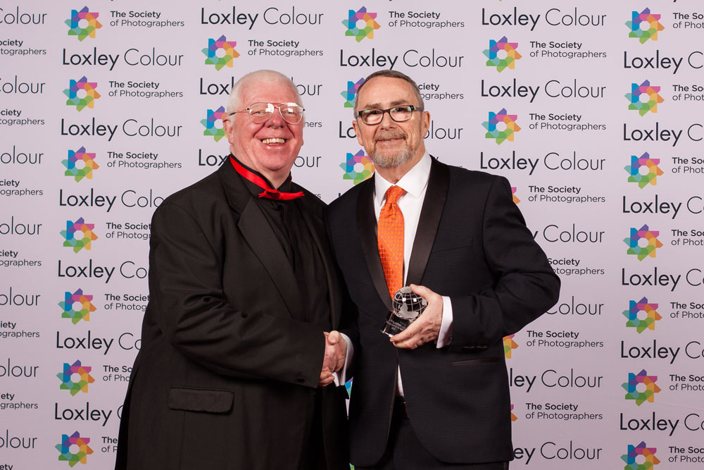 Phil Jones, The Society of Photographers’ Director presenting Terry with the trophy.