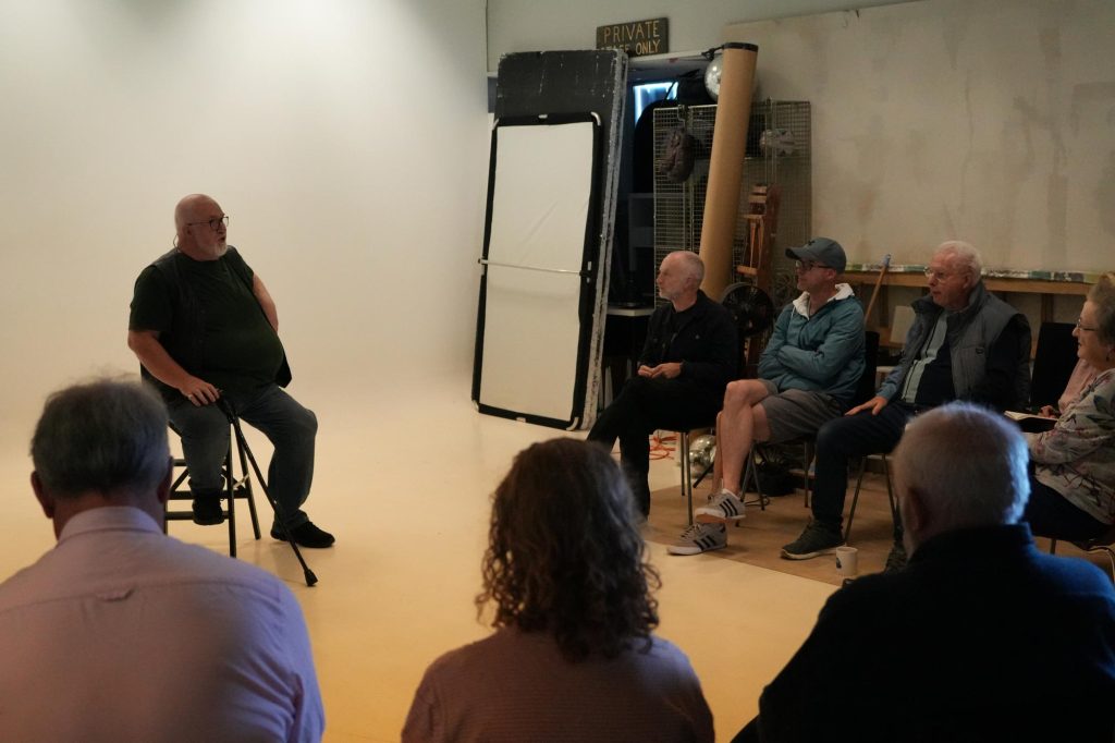 Damian McGillicuddy explaining lighting concepts to photographers during the Widnes workshop.