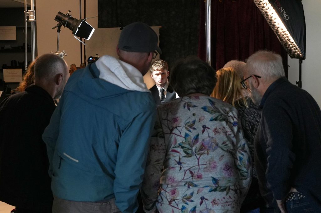 Photographers watching Damian McGillicuddy break down a professional lighting setup.