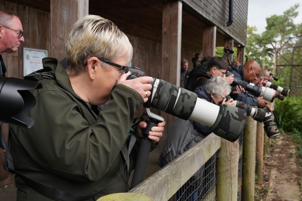Attendees reviewing their images and sharing tips during the photography day.