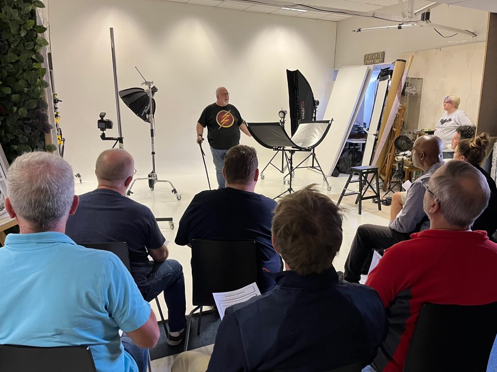 Damian McGillicuddy explaining lighting principles to photographers
