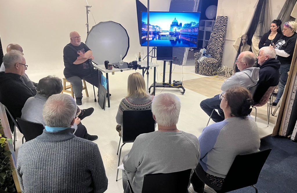 Photographers attending the Liquid & Glass Photography Evening Seminar in Widnes, watching Damian McGillicuddy’s live demonstration.