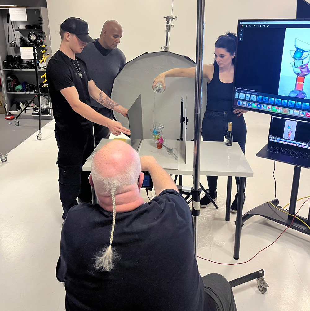 Damian McGillicuddy capturing a liquid splash shot during a live demonstration.