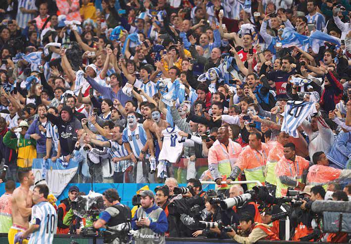 Messi goes over to the adoring Agentinian fans after a match.
